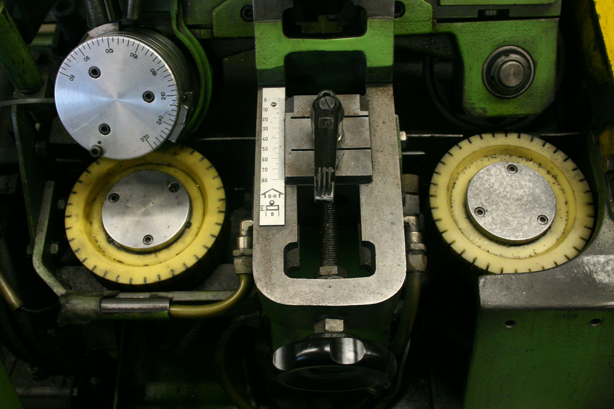 Close-up of industrial machinery with gears and dials