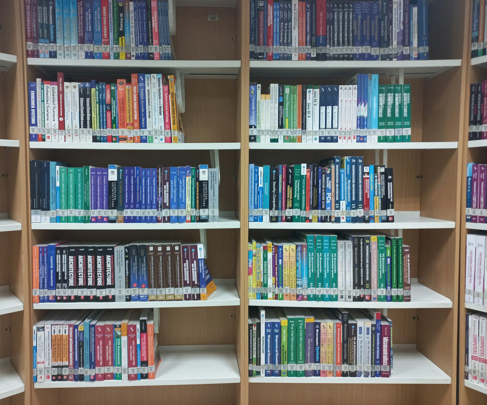 A bookshelf filled with lots of books
