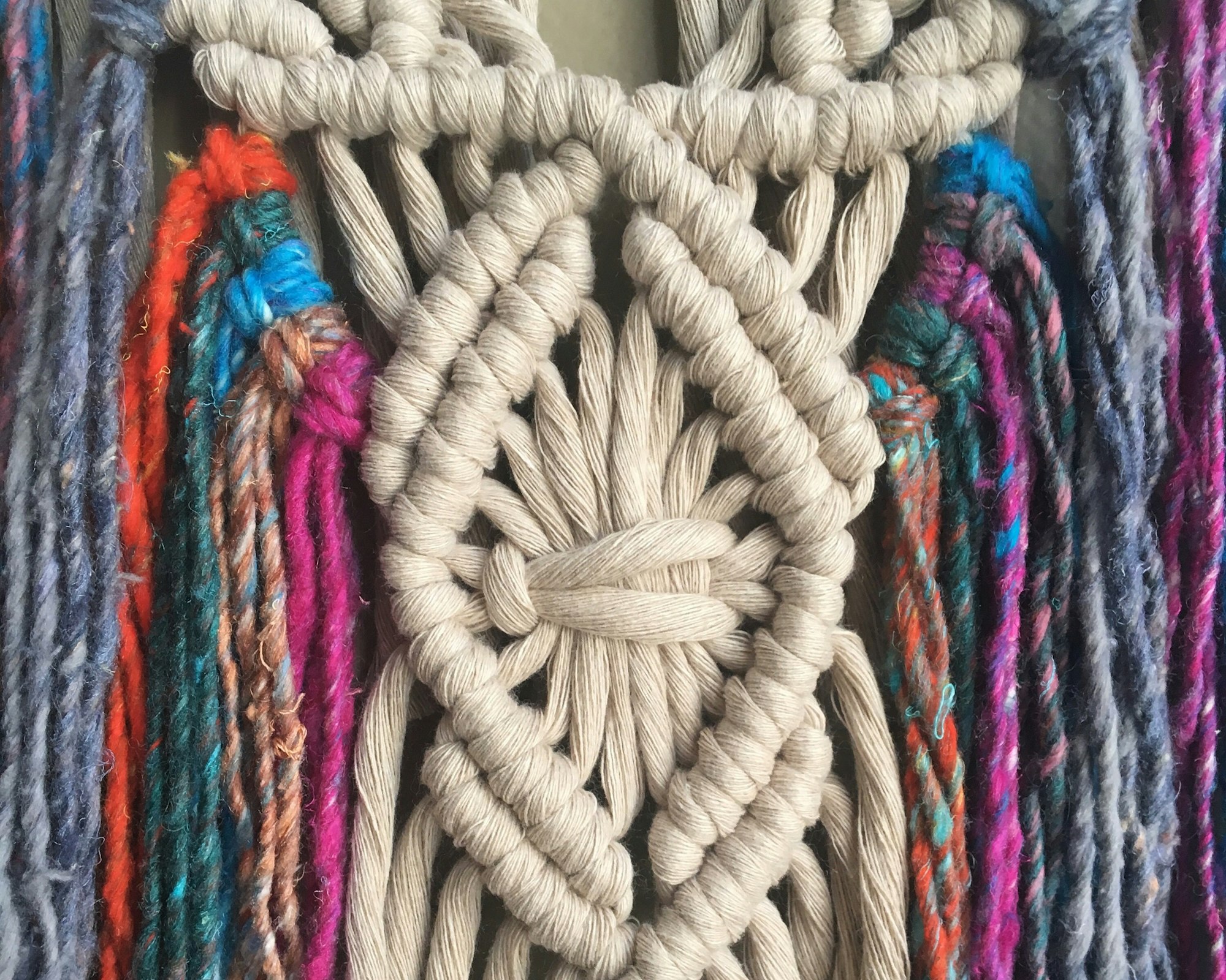 Stacked books with one open, showing pages