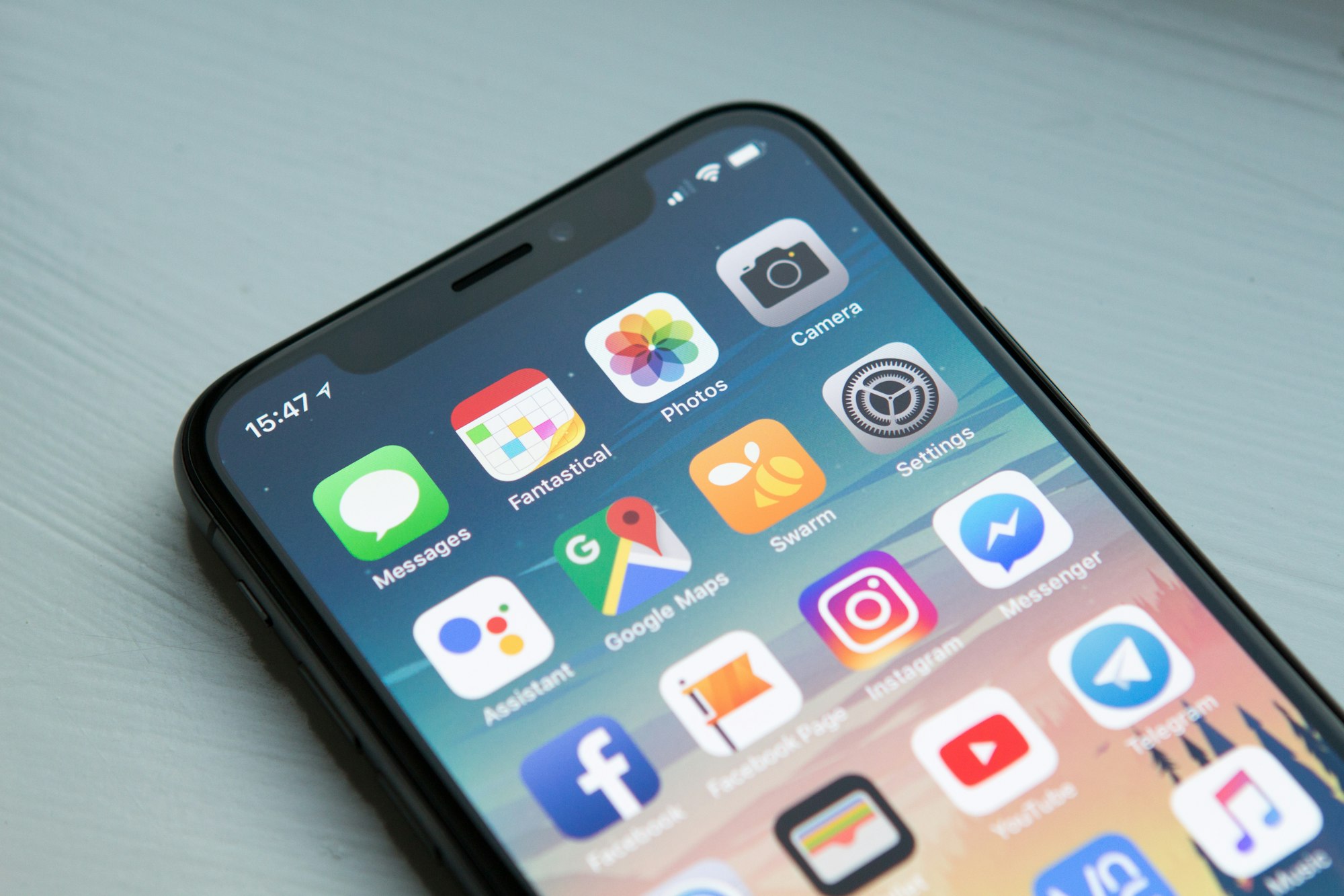 A smartphone displaying app icons on its screen