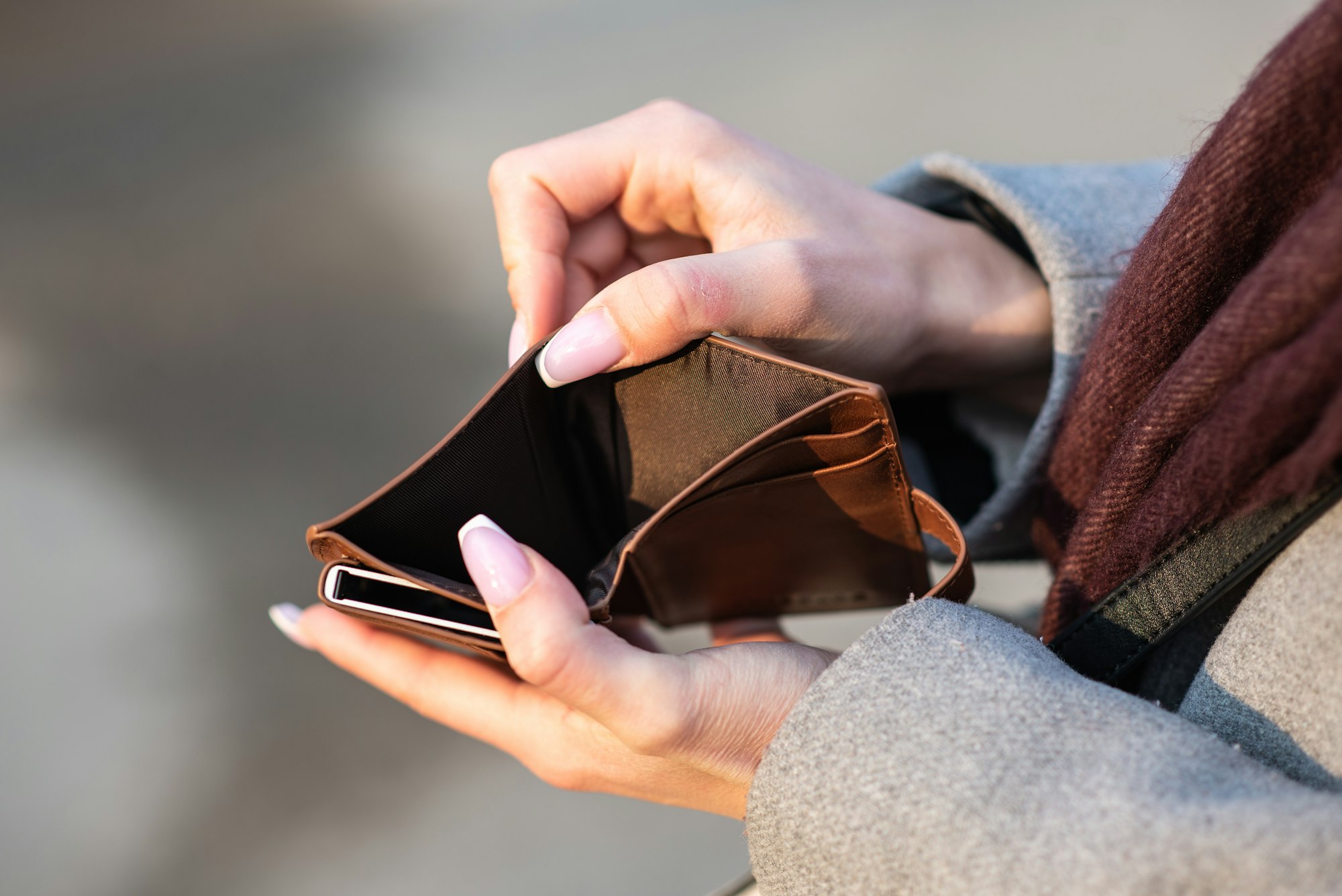 Hands holding an empty wallet