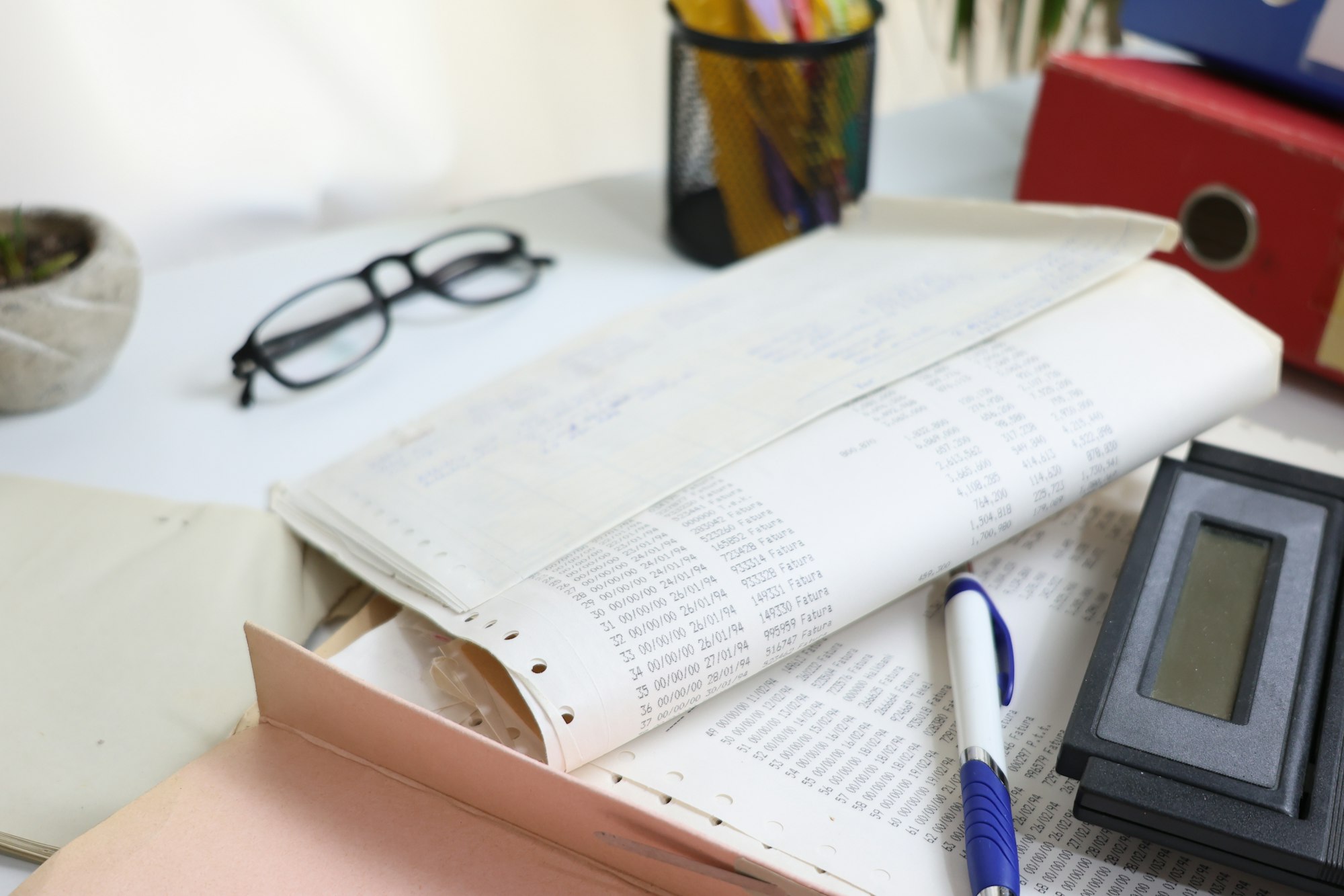 Desk with papers glasses calculator and office supplies for tax preparation