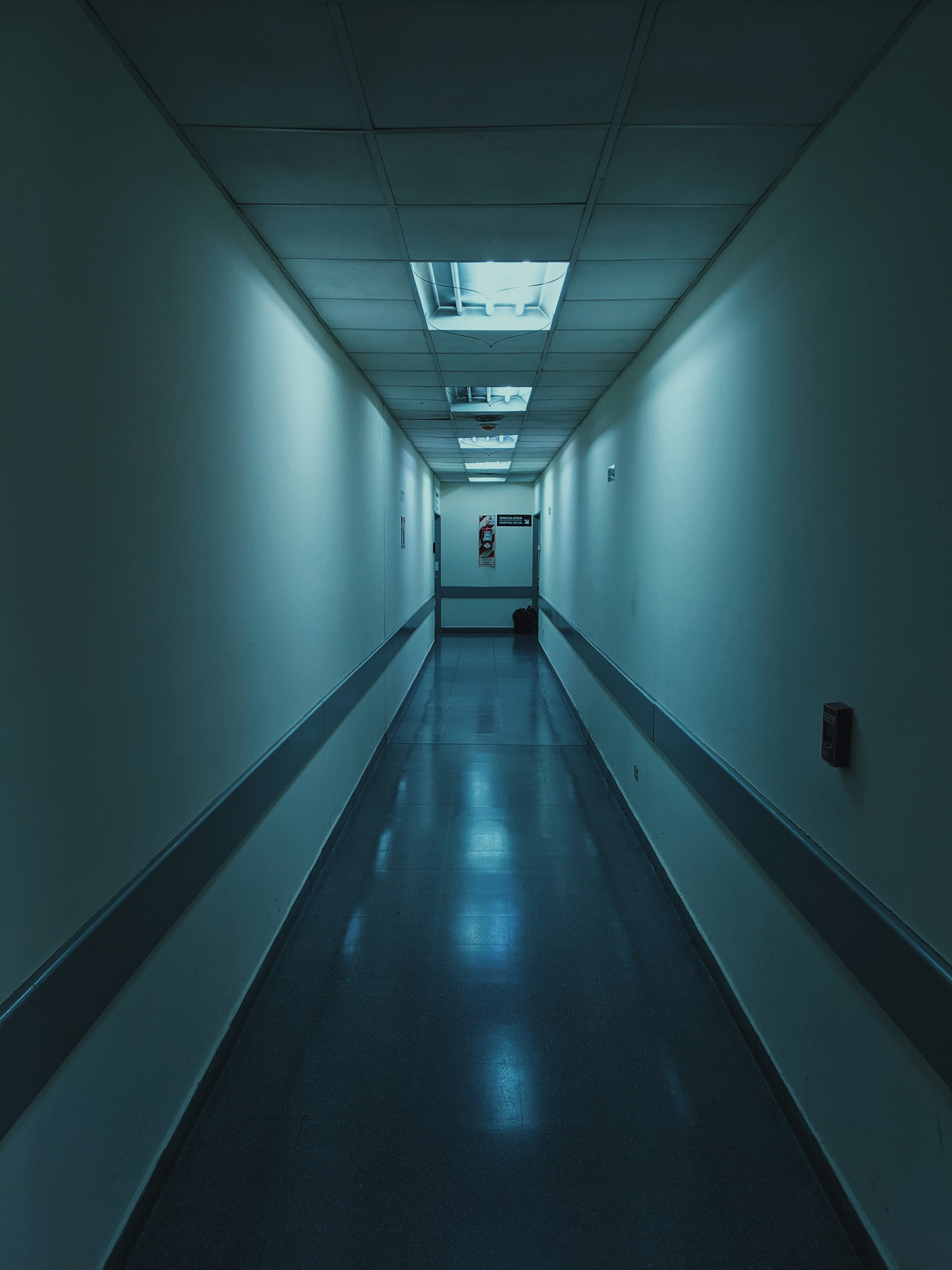 A white hospital hallway lit with soft light