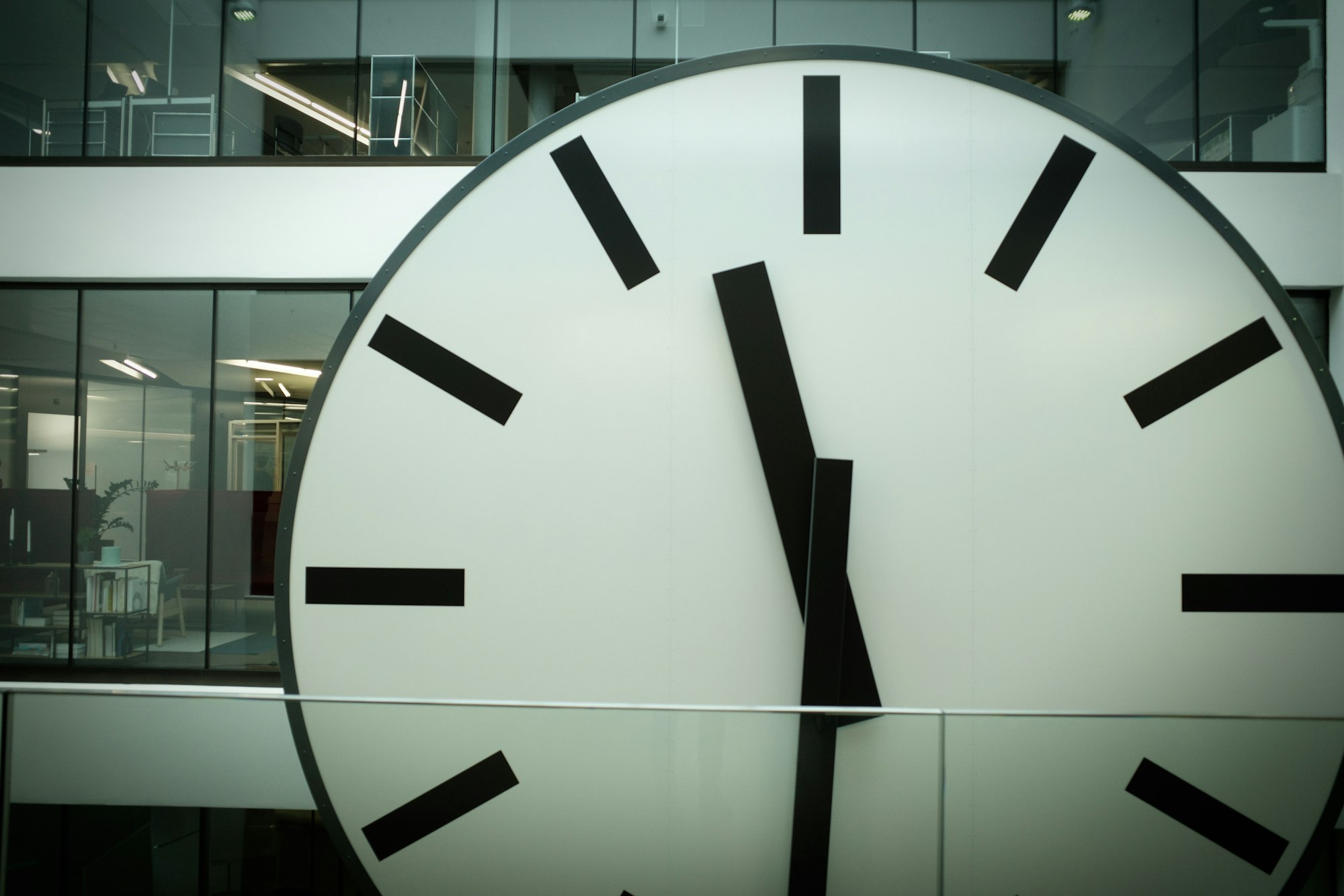 Round white and black analog clock