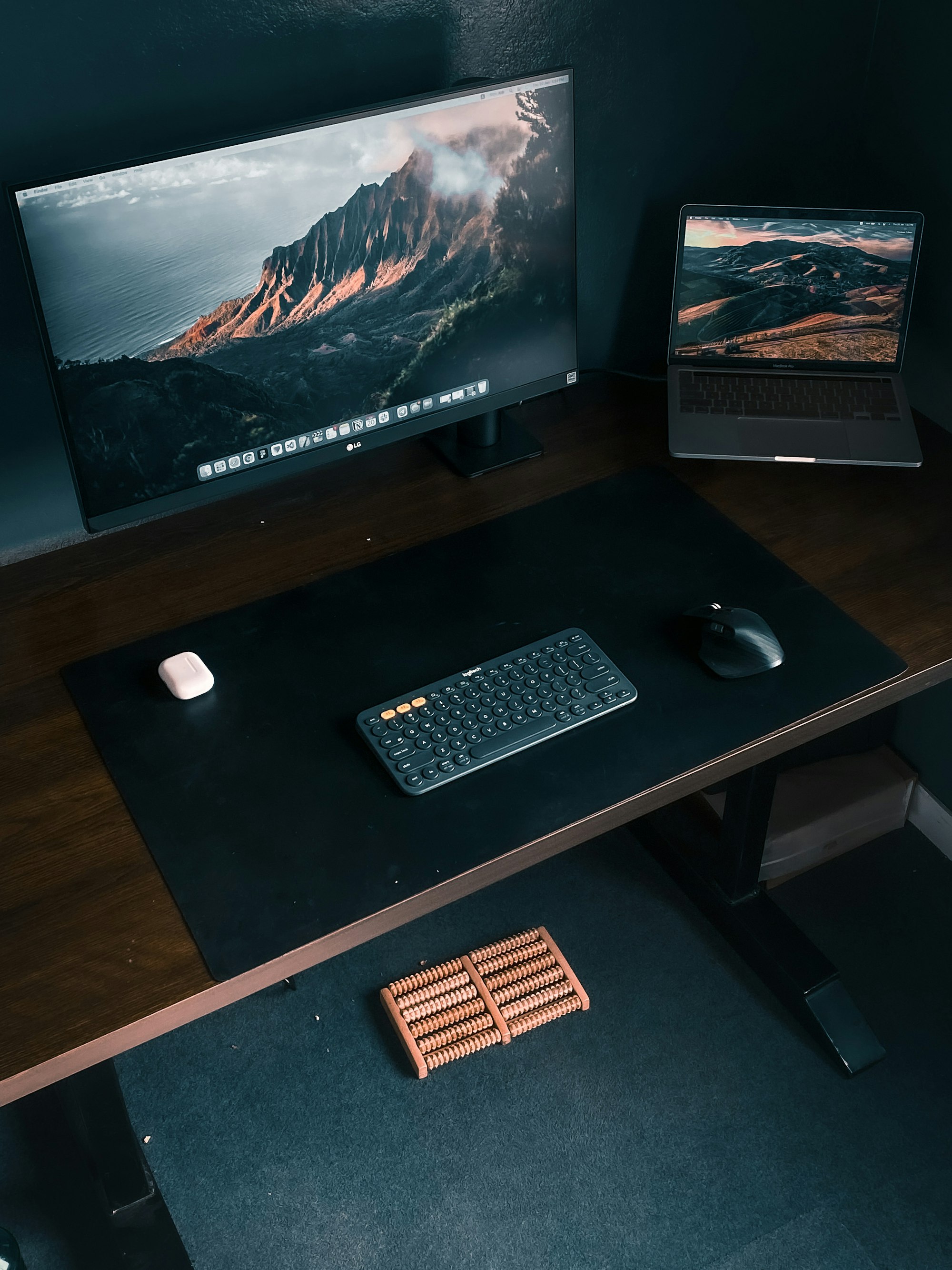 A desk with a keyboard, mouse and monitor on it