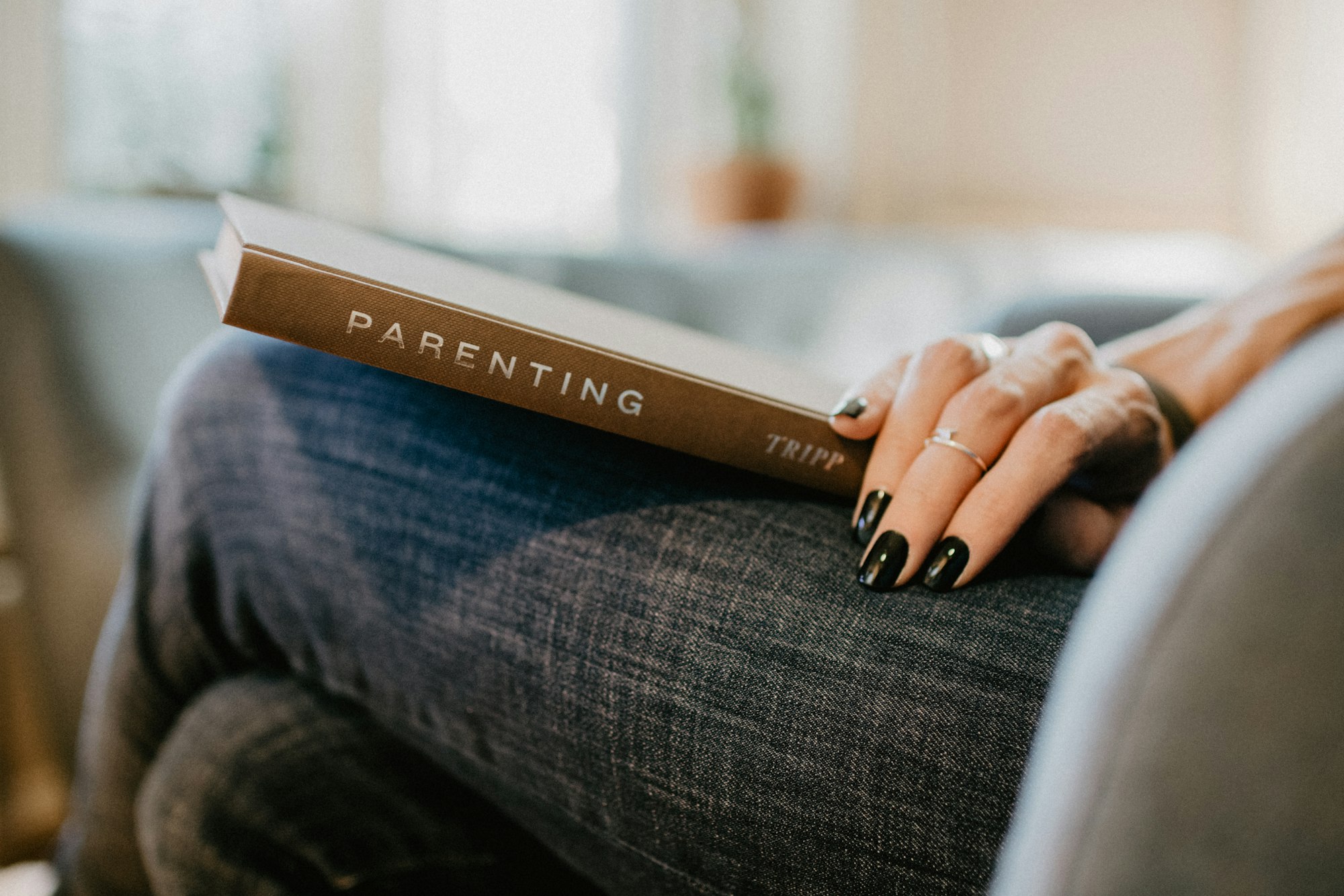 Woman reading a parenting book