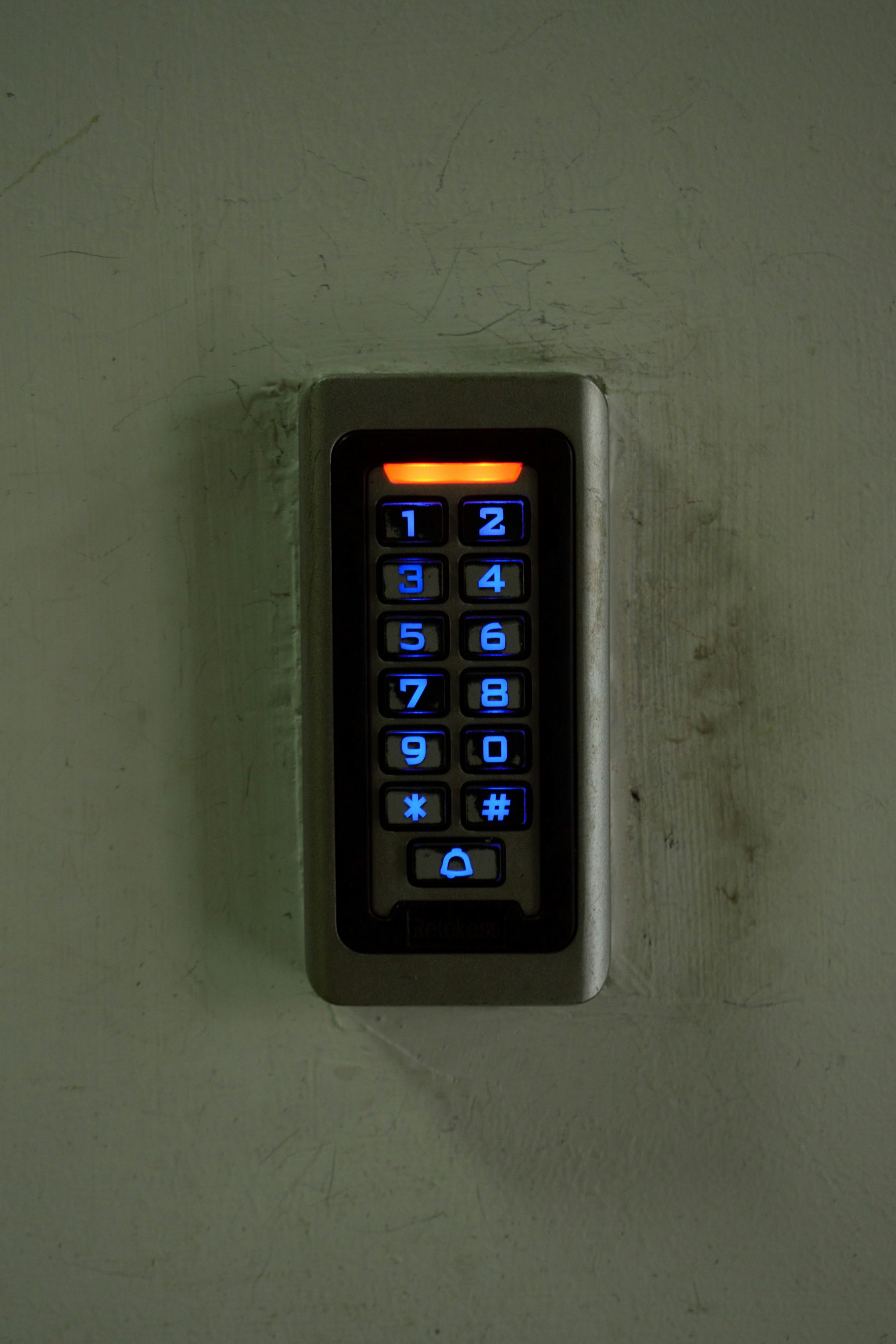 A key board mounted to a wall in a room