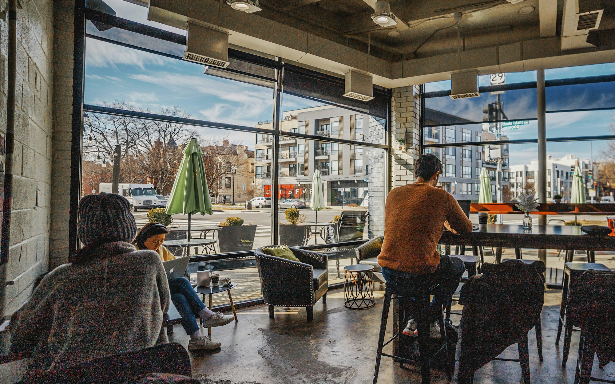 A group of people sitting at a table in a restaurant