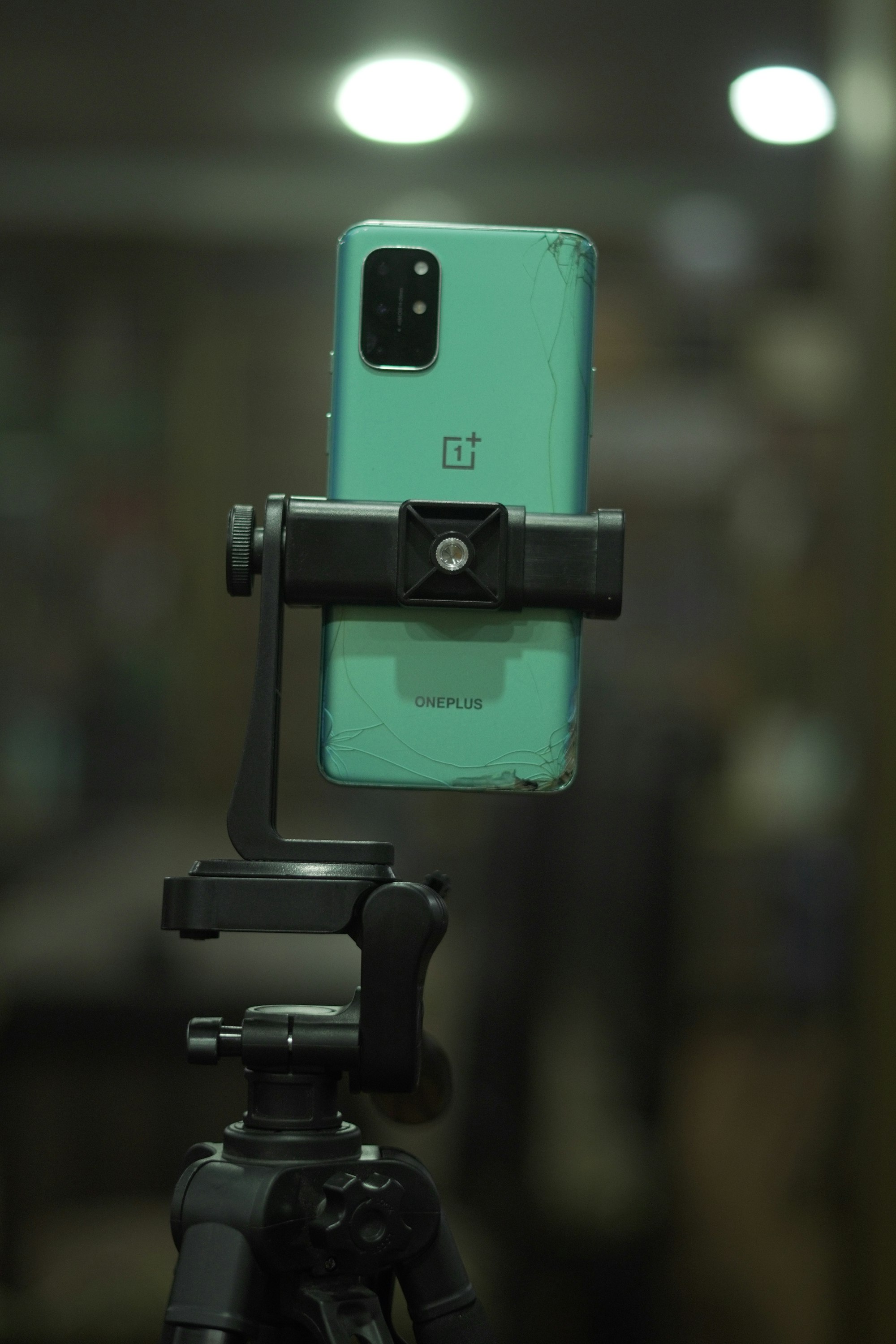 Smartphone mounted on a tripod with adjustable arm