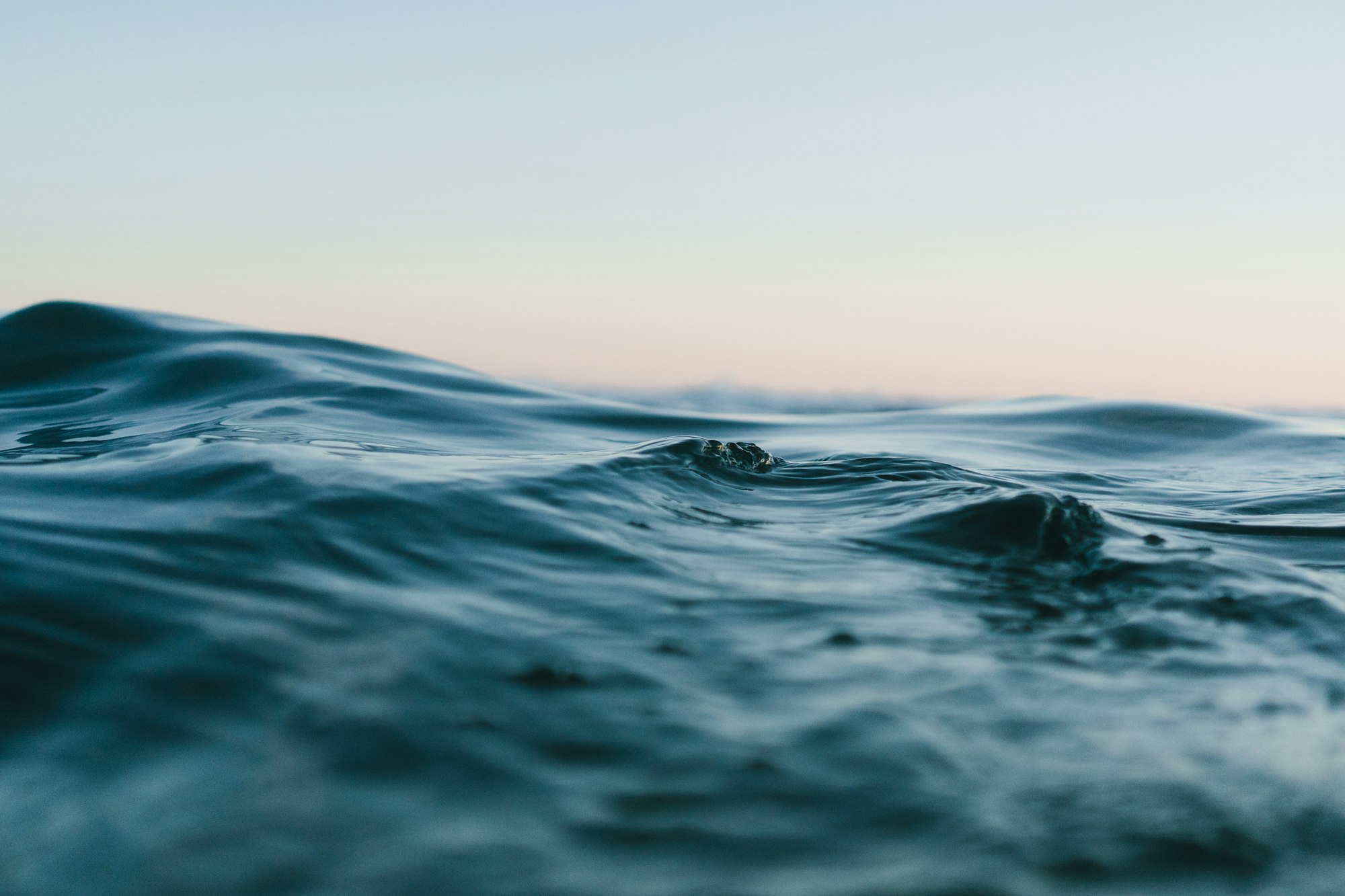 A calm body of water under an open sky