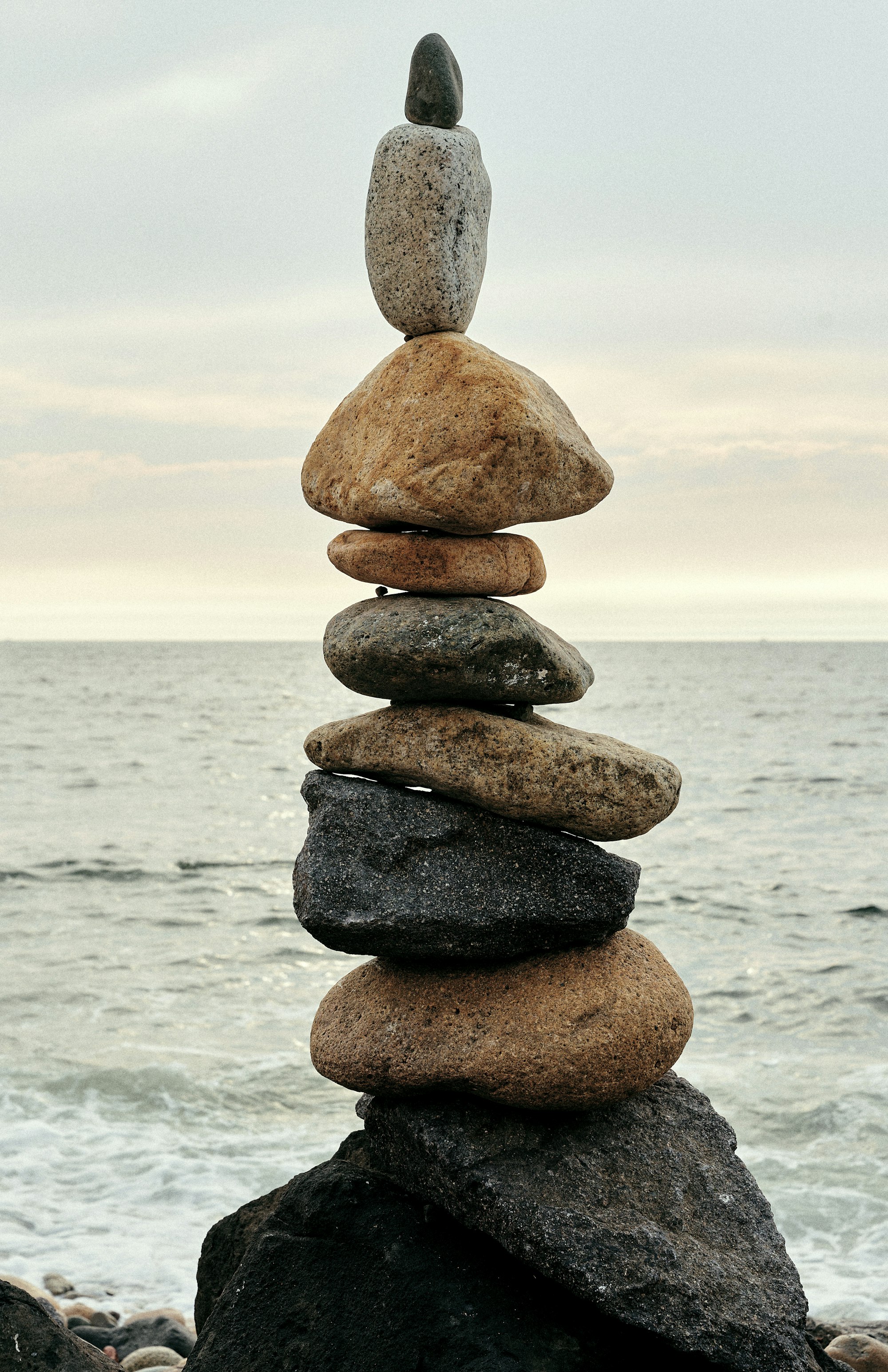 A stack of rocks sitting on top of a beach