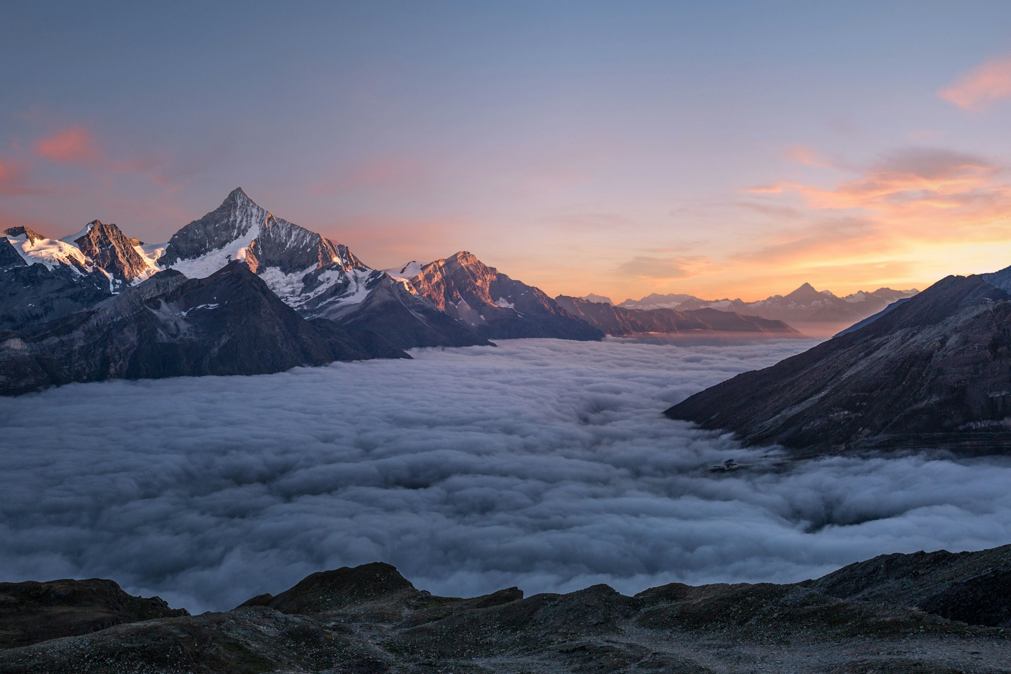 A winding road through morning mist, symbolizing the long path of delayed beginnings