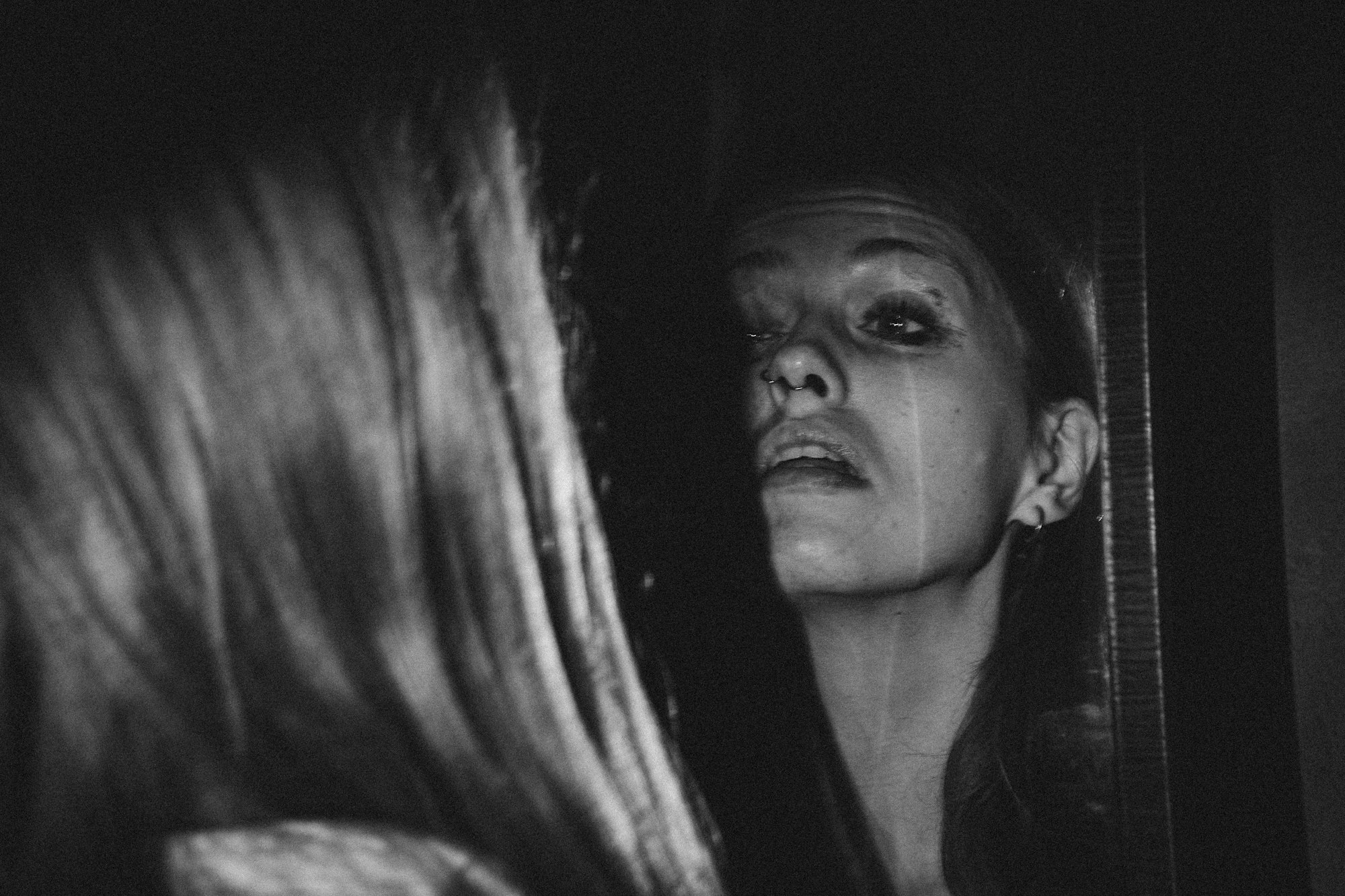 A polished mirror reflecting a distorted image, symbolizing the gap between perfectionist ideals and reality