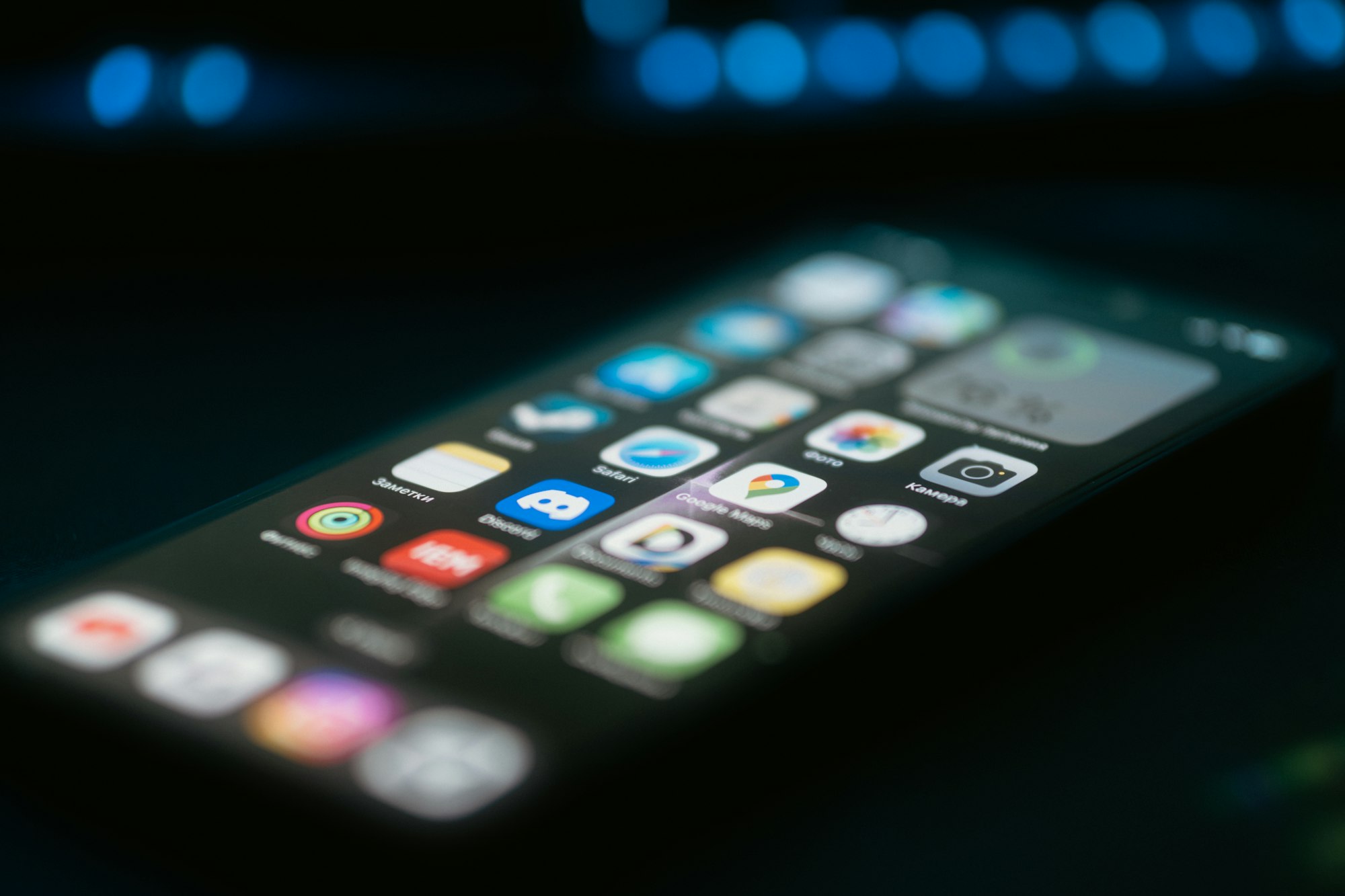 A close-up of a smartphone glowing on a table