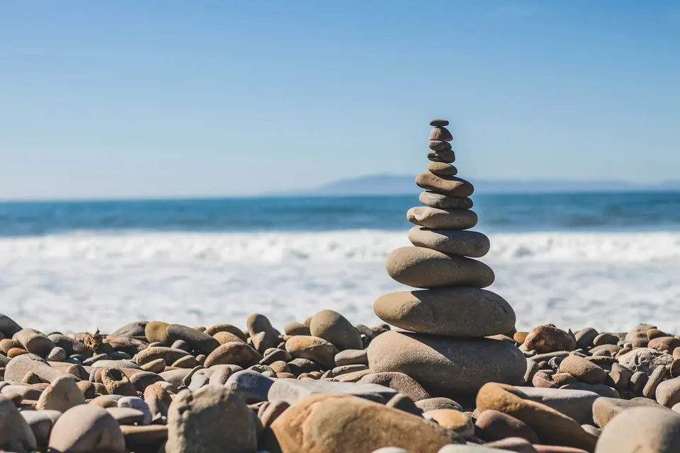 A balanced stack of rocks on the seashore