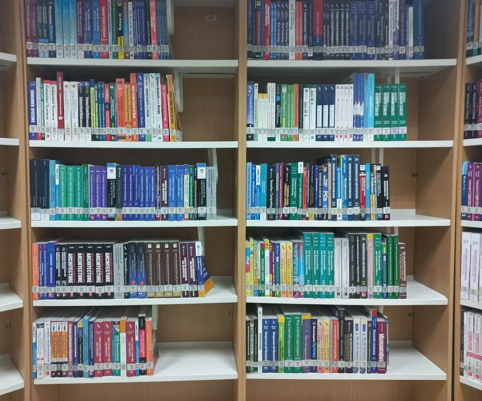 A bookshelf filled with lots of books