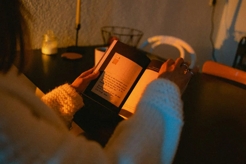 Person holding black tablet computer