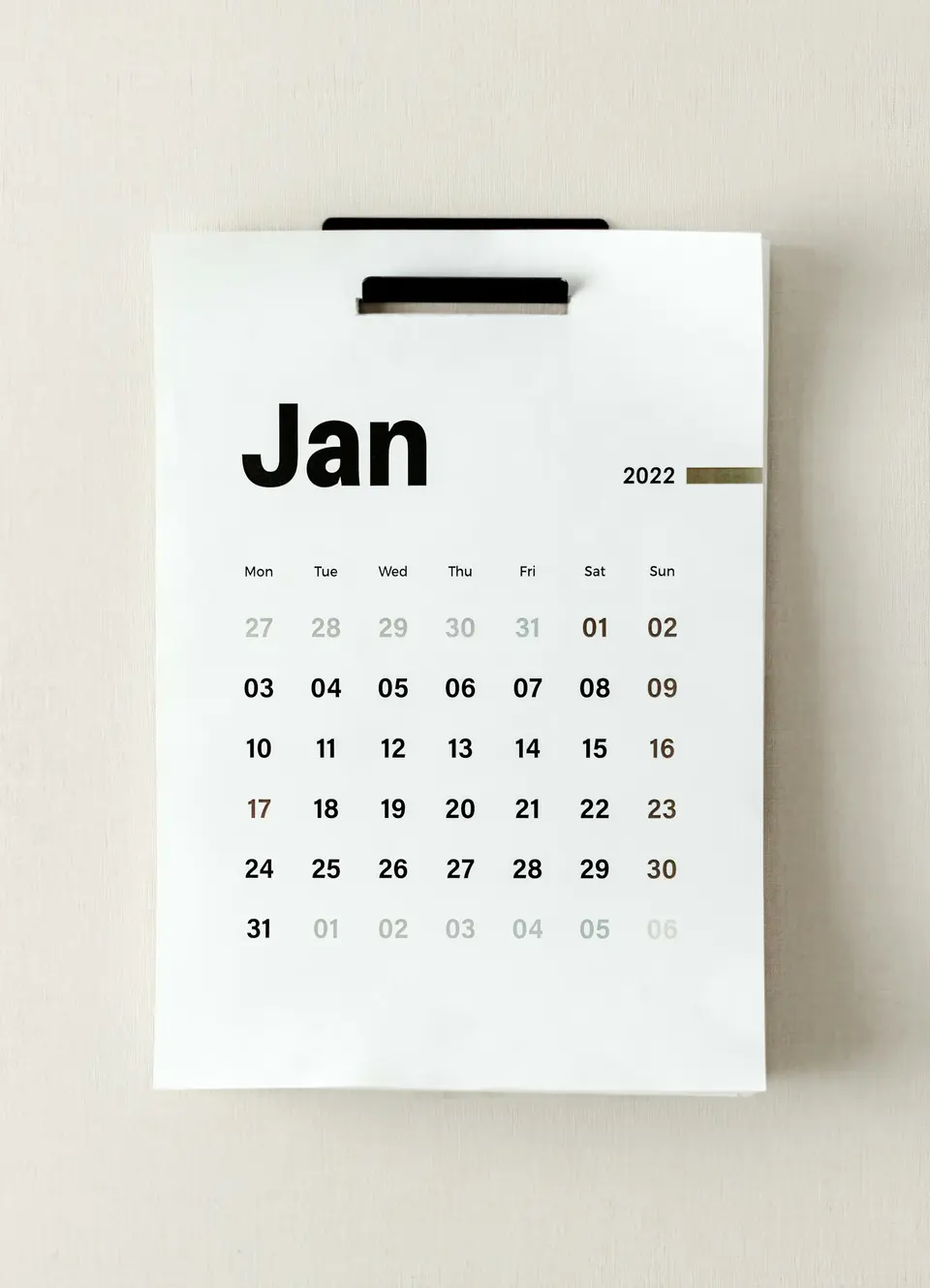A January 2022 calendar hanging on a wall